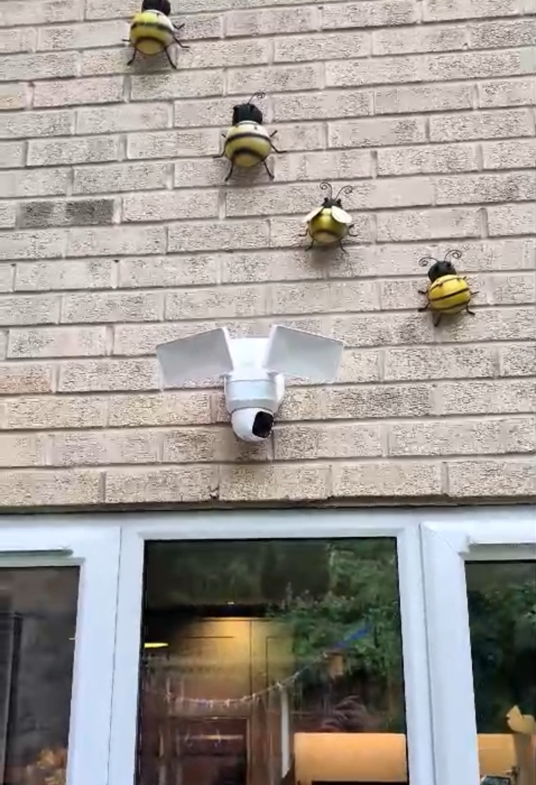 Eufy floodlight CCTV camera installed above a rear entrance