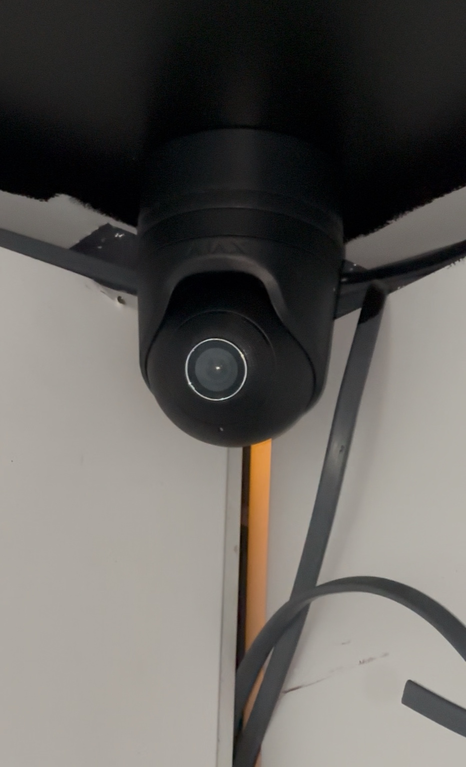 Discreet black CCTV camera inside The Tan Station
