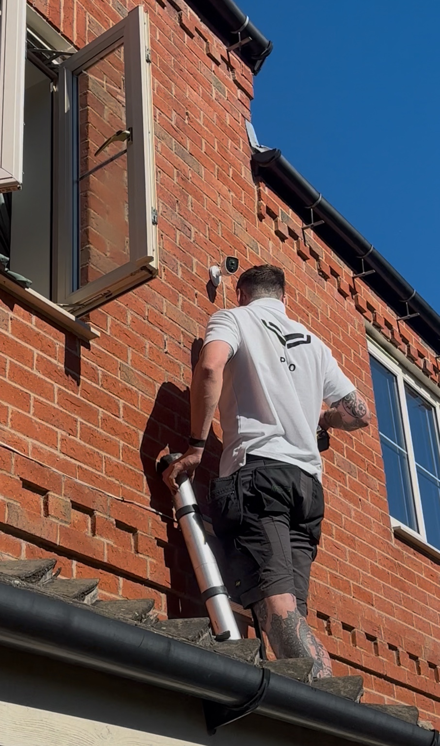 NOX engineer installing security at a residential outbuilding