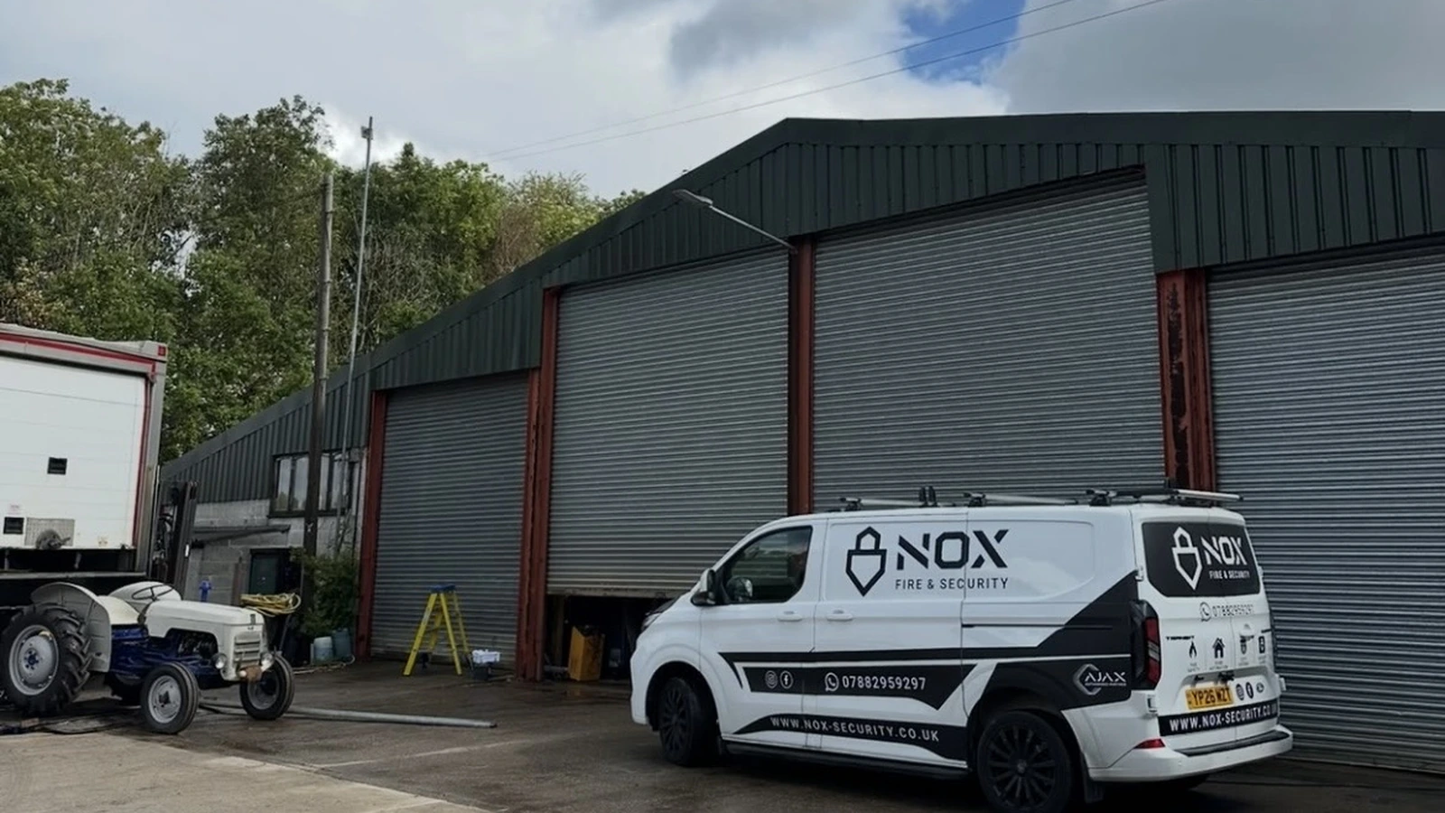 NOX Fire & Security van parked outside a commercial unit